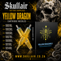 Promotional graphic for Skullair Tattoo Supplies Yellow Dragon Cartridge Needles, showing two translucent yellow cartridge needles in front of a black box labeled 'Yellow Dragonfly,' with a list of needle sizes on the left and a large skull illustration in the background.