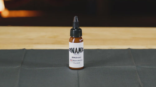 Dynamic Brown tattoo ink bottle on a countertop