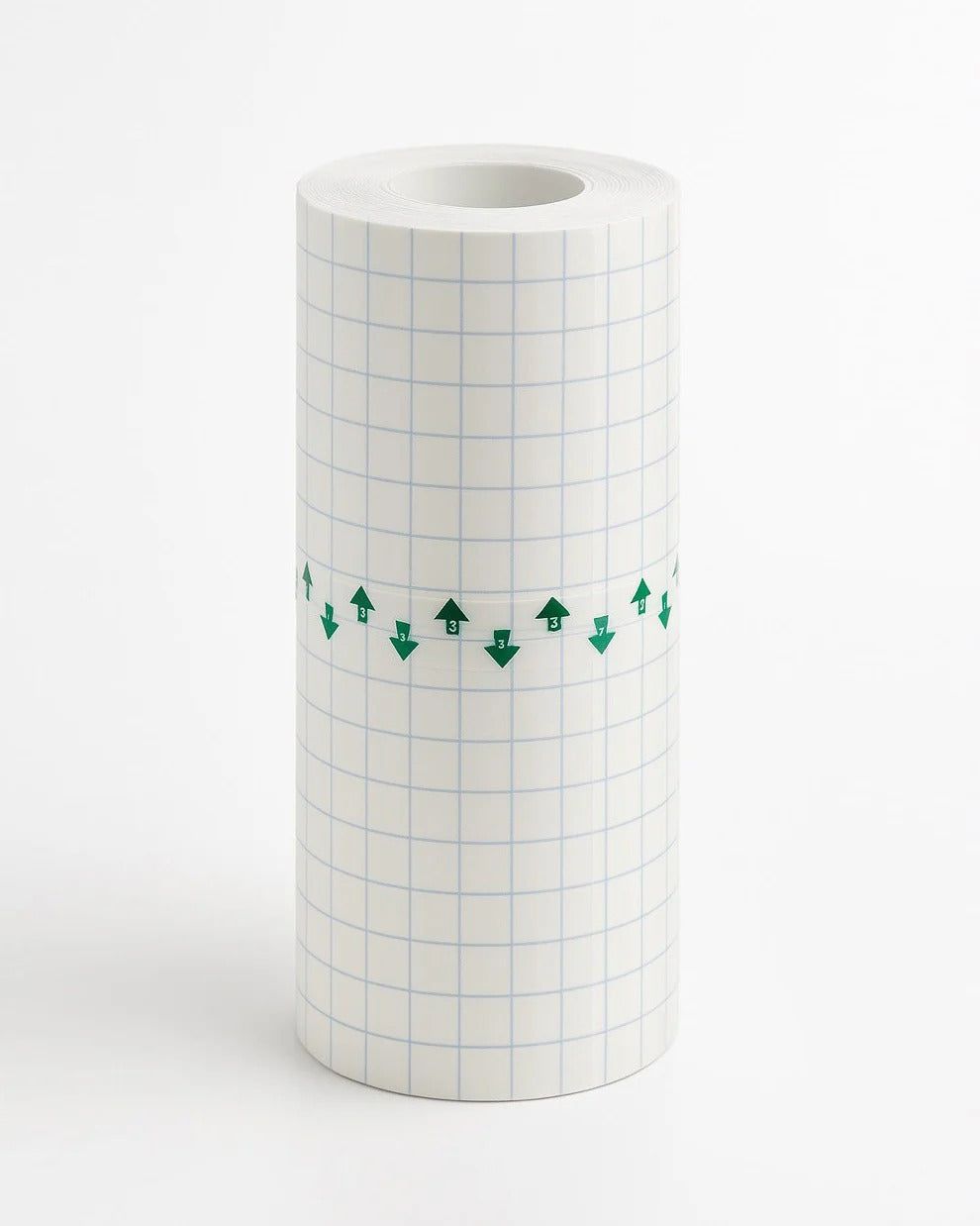 Upright roll of transparent tattoo protective film with grid backing