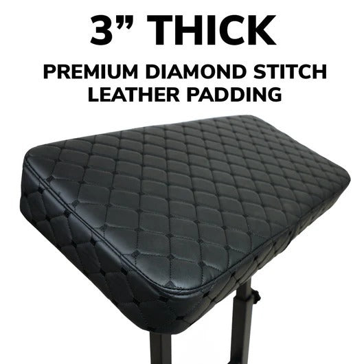 Close-up of diamond-stitched black padding on a tattoo armrest